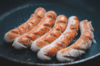 High angle view of meat on barbecue grill