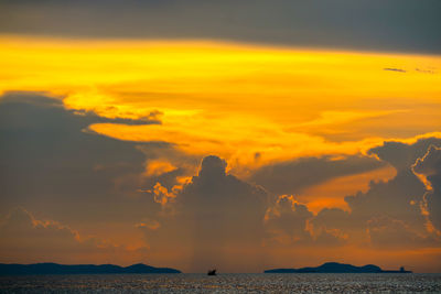 Scenic view of sea against orange sky