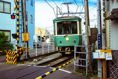 Train on railroad track against sky