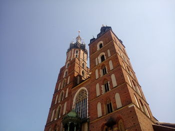 Low angle view of clock tower against sky