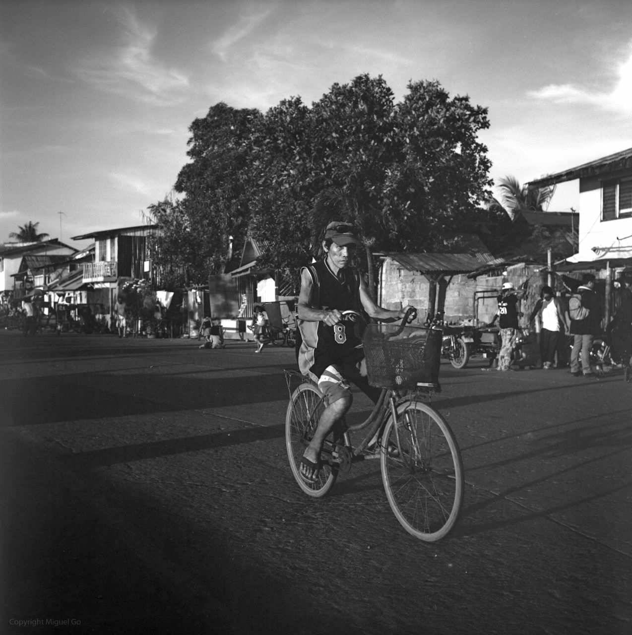 transportation, land vehicle, mode of transport, bicycle, building exterior, street, tree, lifestyles, architecture, city, car, built structure, men, road, sky, leisure activity, full length, city life