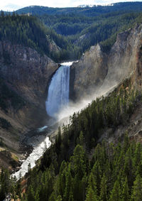 An impressive waterfall on the yellowstone river in yellowstone park.