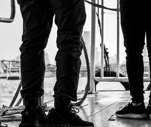 Low section of people standing on boat