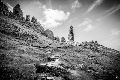 Low angle view of rocks against sky