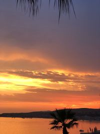 Scenic view of sea against romantic sky at sunset