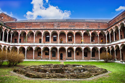 View of historic building against cloudy sky