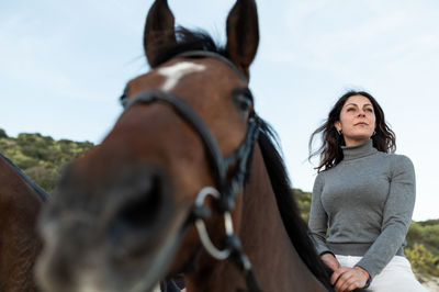 Portrait of woman riding horse