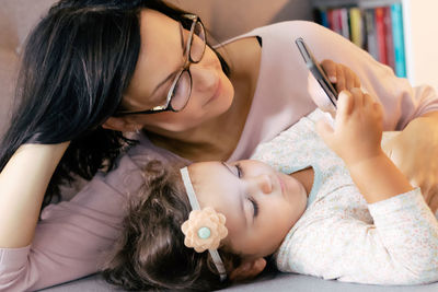 Midsection of woman using mobile phone