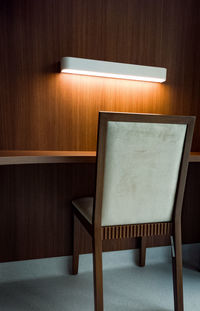 Close-up of empty chair on table at home