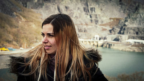 Young woman standing outdoors during winter