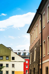 Low angle view of buildings in city against sky