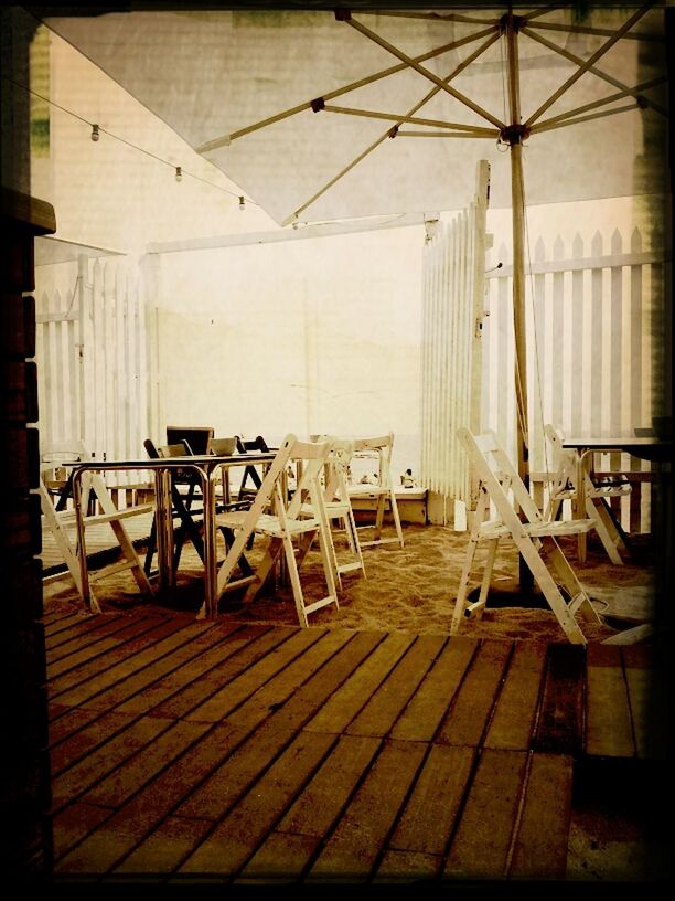 transfer print, indoors, auto post production filter, wood - material, empty, wooden, absence, chair, built structure, wood, architecture, door, flooring, abandoned, no people, day, old, table, sunlight, bench