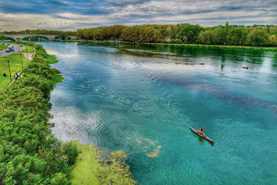 High angle view of person on lake against trees