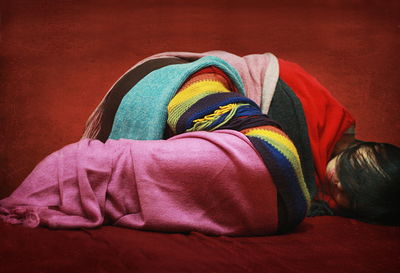 Woman sleeping on rug