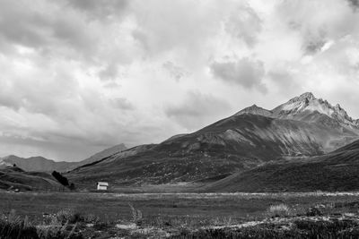 Scenic view of landscape and mountains against sky