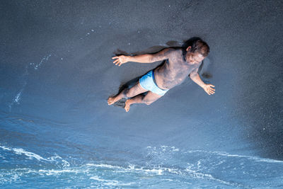 Man jumping in sea