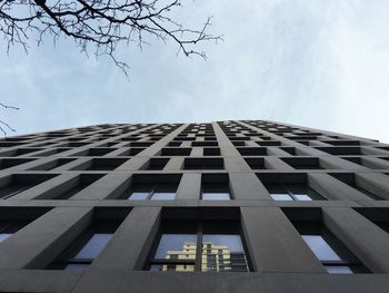 Low angle view of office building against sky