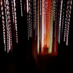 Close-up of illuminated lanterns hanging at night