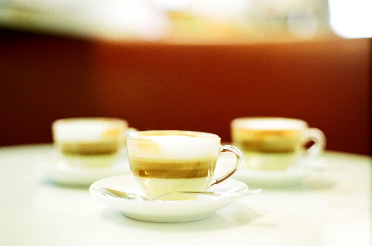 CLOSE-UP OF COFFEE SERVED ON TABLE