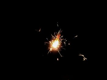 Close-up of illuminated firework display at night