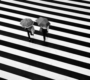 High angle view of people crossing road