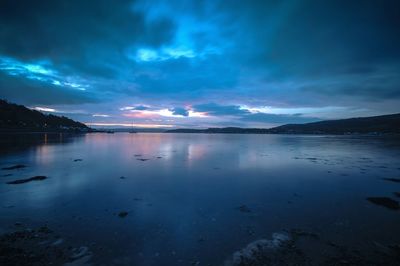 Scenic view of sea against sky at night