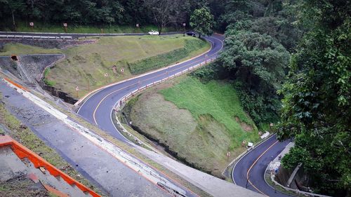 High angle view of mountain road amidst trees