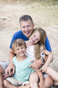 Portrait of family sitting outdoors