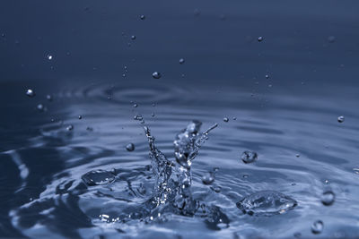 Full frame shot of raindrops on water