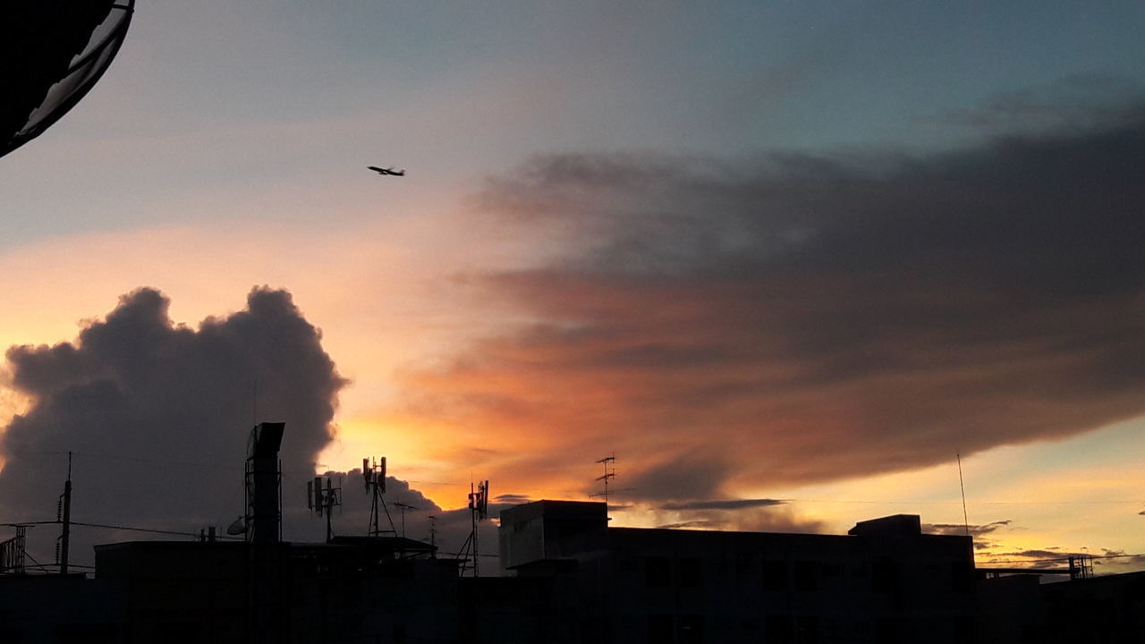 SILHOUETTE BUILDING AGAINST SKY DURING SUNSET