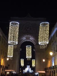 Low angle view of illuminated building at night