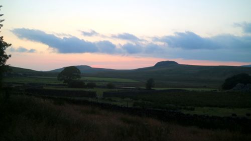 Scenic view of landscape against sky during sunset