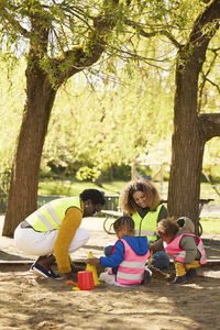 Volunteer playing with family in park