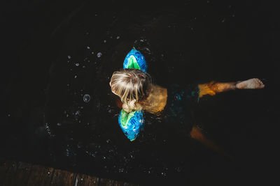 Boy swimming in sea