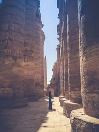 Man sitting in front of temple