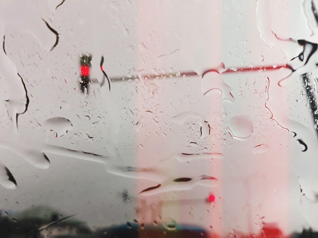 FULL FRAME SHOT OF WET CAR WINDOW