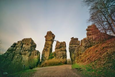 Low angle view of rocks against sky