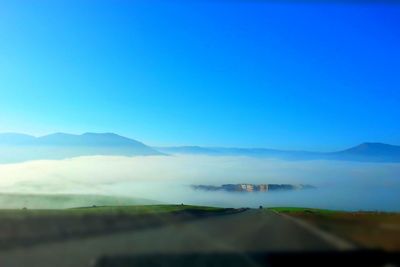 Scenic view of landscape against clear blue sky