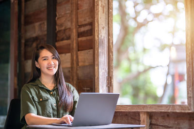 Young woman using laptop at home