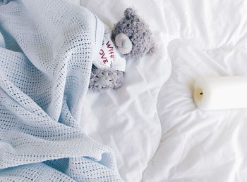 Overhead view stuffed toy on bed