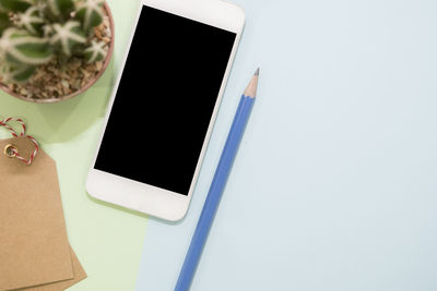 High angle view of mobile phone on table