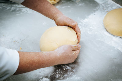 Midsection of man preparing food