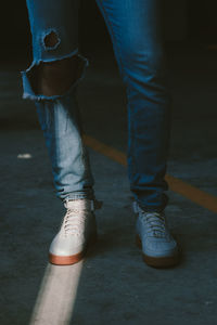 Low section of man standing outdoors