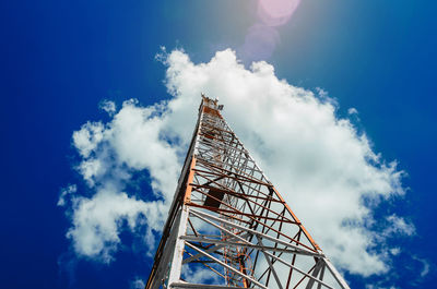 Low angle view of communications tower against sky