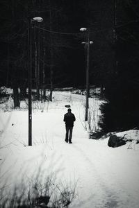 Man standing in field during winter