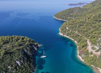 Aerial view of sailboat sailing in sea