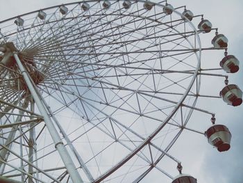 Low angle view of ferris wheel against sky