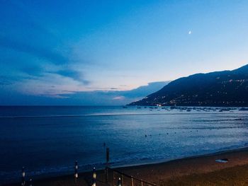 Scenic view of sea against sky at sunset