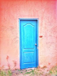 Closed blue door of building