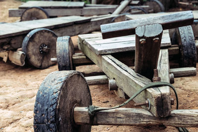 Close-up of old wooden logs on field